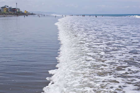 SAN CLEMENTE ECUADOR, FEBRUARY-2013  Vacationers playing in the surf Feb 2013 in San Clemente Ecuador San Clemente is a fishing village on the Pacific coast of Ecuador のeditorial素材