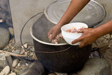 ZAMORA REGION, YANTZAZA, ECUADOR-Circa 2013 Traditional Chicken soup being prepared over an open fire Ecuador Circa 2013. Soup prepared with chicken feet are a staple of the Ecuadorian diet.のeditorial素材