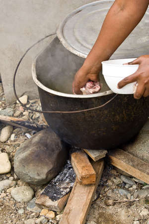 ZAMORA REGION, YANTZAZA, ECUADOR-Circa 2013 Traditional Chicken soup being prepared over an open fire Ecuador Circa 2013. Soup prepared with chicken feet are a staple of the Ecuadorian diet.のeditorial素材