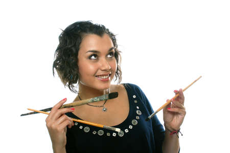 pretty girl with paint brushesの写真素材