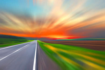 Blurred road and blurred sky with sunsetの写真素材