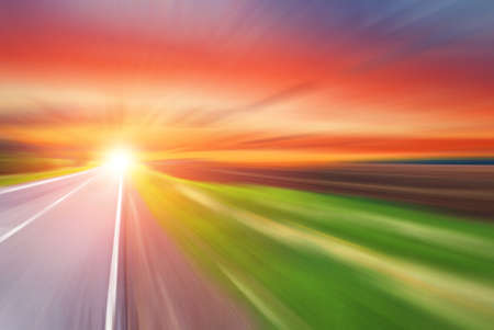 Blurred road and blurred sky with sunsetの写真素材