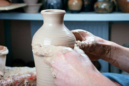 Ceramic bottle on a potter's wheelの写真素材