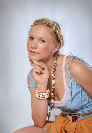 Portrait of a blonde girl with a braidの写真素材