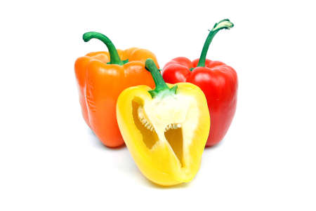 a yellow red and green pepper shooted on whiteの写真素材