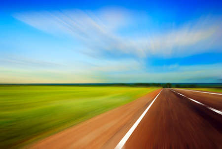 blured road and blue skyの写真素材