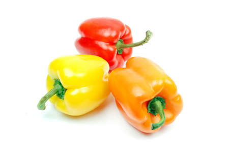 a yellow red and green pepper shooted on whiteの写真素材