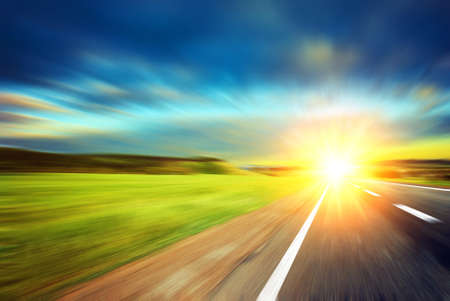 Blurred road and blurred sky with sunsetの写真素材