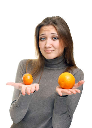 young woman with orangesの写真素材