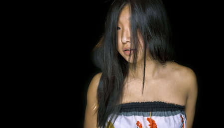 Portrait of beautiful asian girl on black backgroundの写真素材