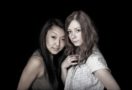 asian and caucasian gilrsの写真素材