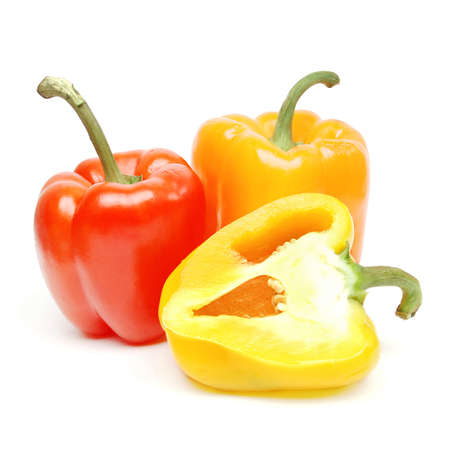 a yellow red and green pepper shooted on whiteの写真素材