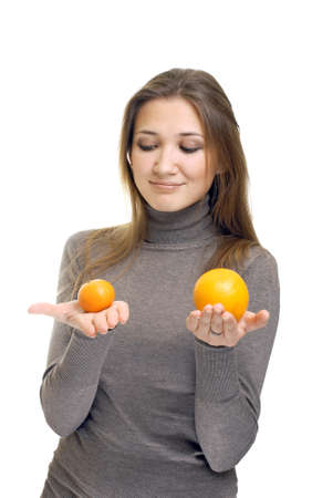 young woman with orangesの写真素材