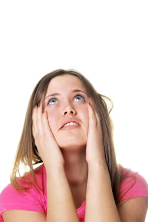 woman with headache holding her head with hands isolated over whiteの写真素材