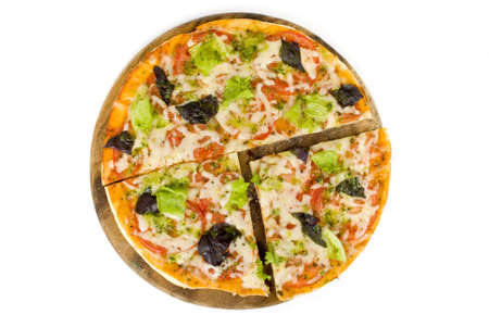 Pizza with the cut off sliceの写真素材