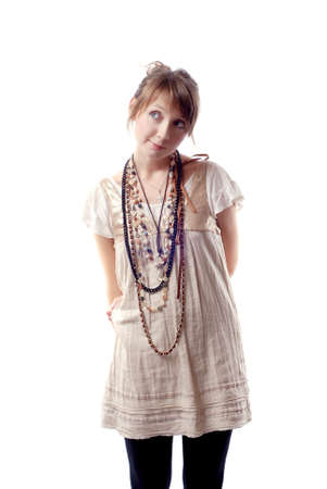 portrait of a beautiful teenager. Looking up into the corner. Lots of copyspace and room for text on this isolateの写真素材