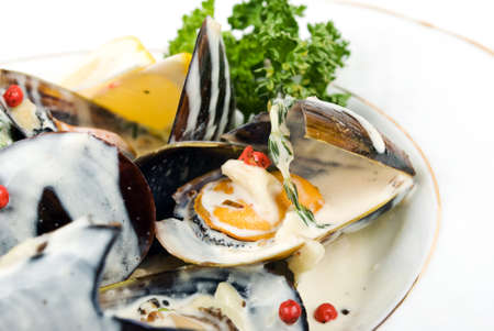Cooked and prepared mussels ready to be eaten.の写真素材