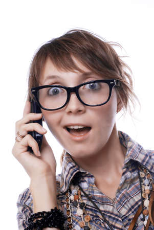 surprised girl with a mobile phoneの写真素材