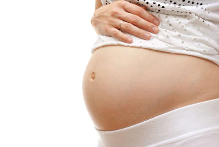 Image of pregnant woman touching her belly with handの写真素材