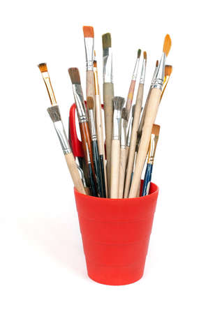 paint brushes in red glassの写真素材