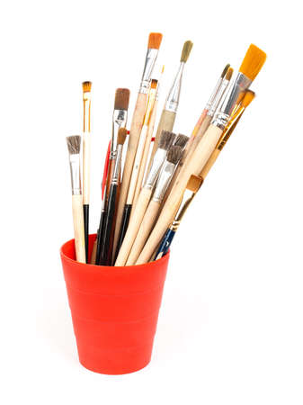 paint brushes in red glassの写真素材