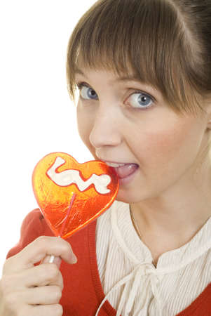 attractive girl with heart lolly popの写真素材