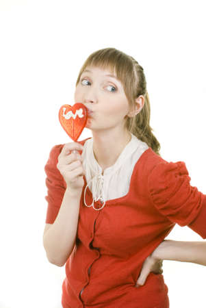 attractive girl with heart lolly popの写真素材