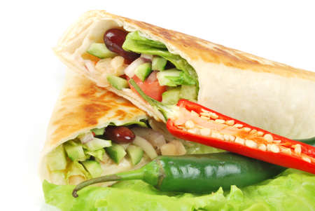 fresh tortilla wraps with vegetables on the plateの写真素材