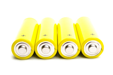 yellow alkaline batteries isolated on white background
