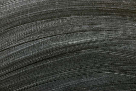 Blackboard / chalkboard texture. Empty blank black chalkboard with chalk tracesの写真素材