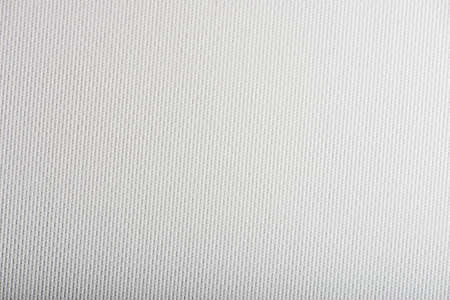 Background from white coarse canvas textureの写真素材