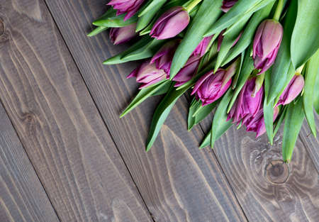 tulips bouquet on wooden background.の写真素材