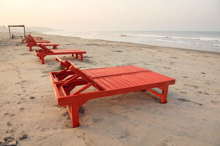 red sunbeds on beachの写真素材
