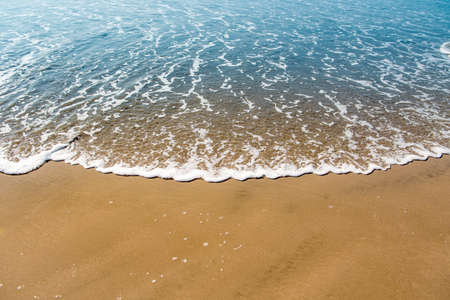 Soft wave of the sea on the sandy beachの写真素材