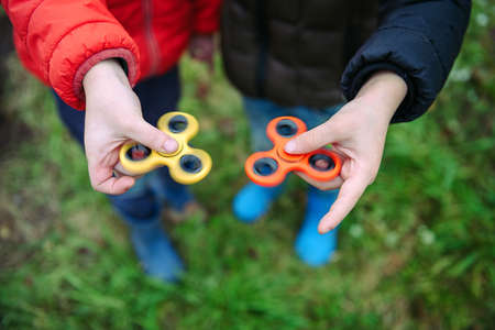 Two fidget spinners. Outdoor.の写真素材