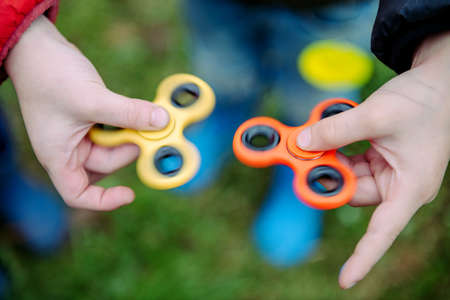 Two fidget spinners. Outdoor.の写真素材
