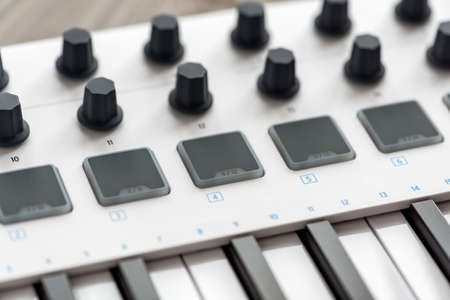 MIDI keyboard with pads and faders.の写真素材