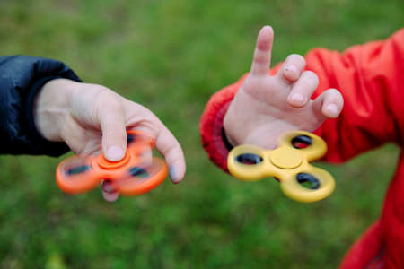 Two fidget spinners. Outdoor.の写真素材