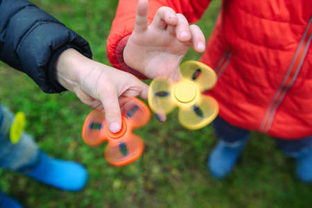 Two fidget spinners. Outdoor.の写真素材