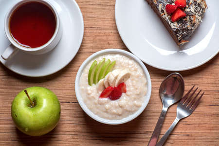 Oat  porridge with strawberry, banana and apple lifestyleの写真素材