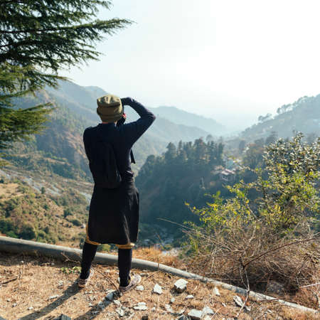 Man take a photo in mountains.の写真素材