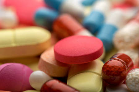 Pharmacy theme. Multicolored Isolated Pills and Capsulesの写真素材