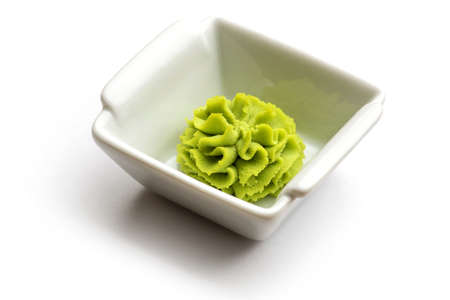 Portion of wasabi in a white gravy boatの写真素材