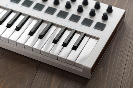 MIDI keyboard with pads and faders.