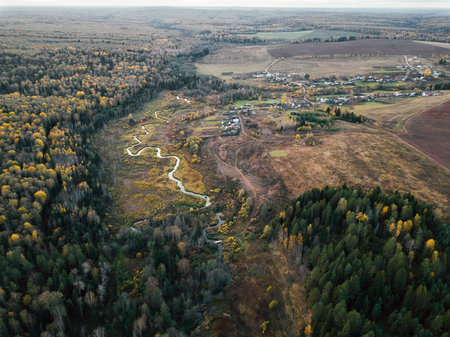 Drone view on river and forest in Russia.