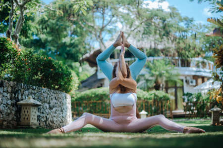 Pair of girls practice yogaの写真素材