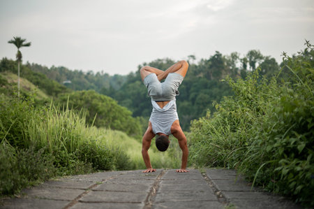 Man practice Yoga practice and meditation outdoor.