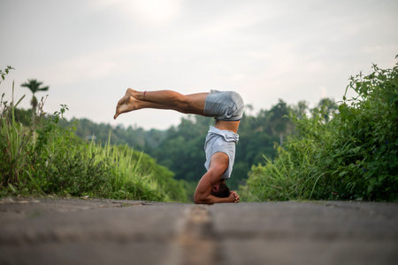 Man practice Yoga practice and meditation outdoor.