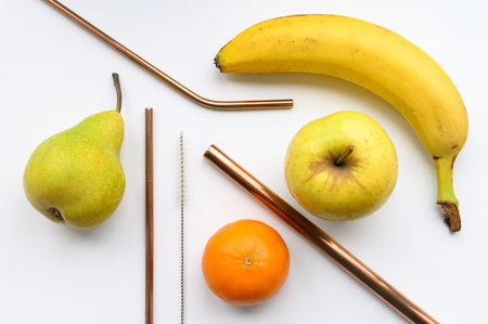 Reusable Steel Drinking Straw And Brush Set with fruit.