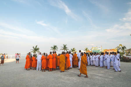 Young buddhists in orange clothes near the Big Buddha Temple in Phuket in Thailand. April 28, 2019.のeditorial素材